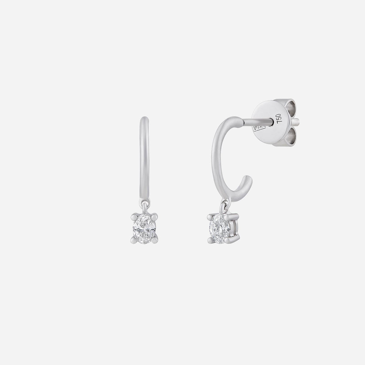 oval drop earrings in 18k white gold with sparkling diamond accents in a delicate drop design.