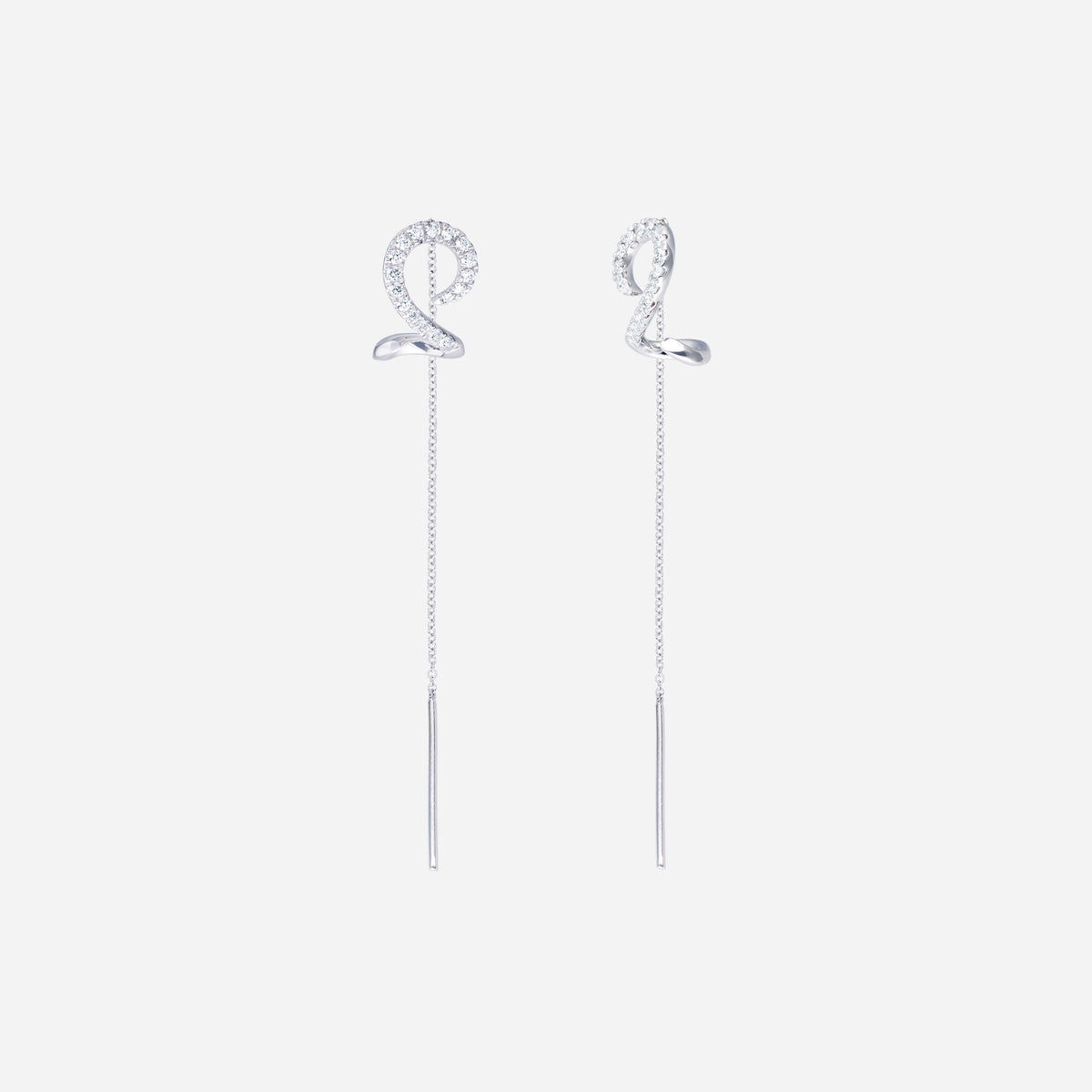 linear shimmer diamond earrings in 18k white gold with a spiral design and diamond accents on slender threader chains.
