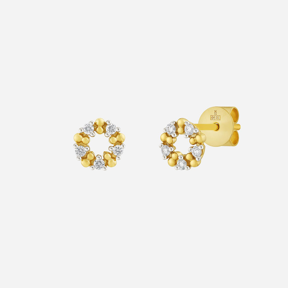 starry diamond earrings in 18k yellow and white gold with a circular design adorned with sparkling diamonds.
