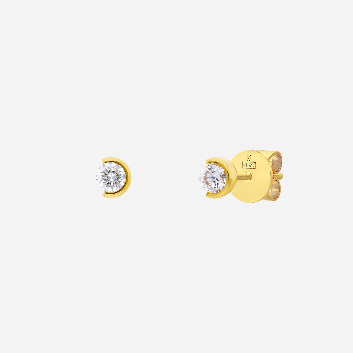 light embrace round diamond earrings in 18k yellow gold with a sleek bezel setting and sparkling round-cut diamonds.
