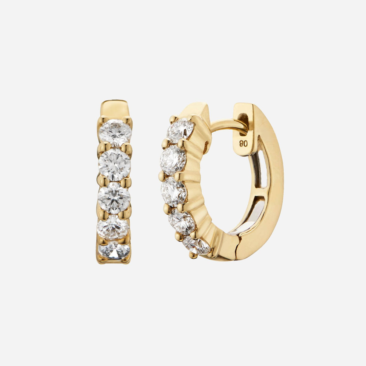 huggie earrings in 18k yellow gold featuring round brilliant diamonds with a total weight of 0.40 carat.