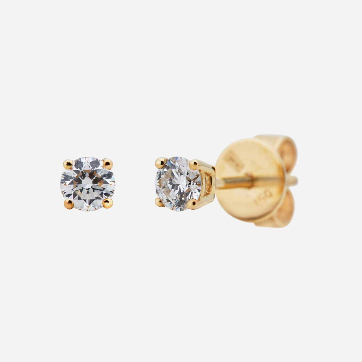 solitaire diamond earrings in 18k yellow gold with a brilliant round diamond set in a 4-claw prong design.