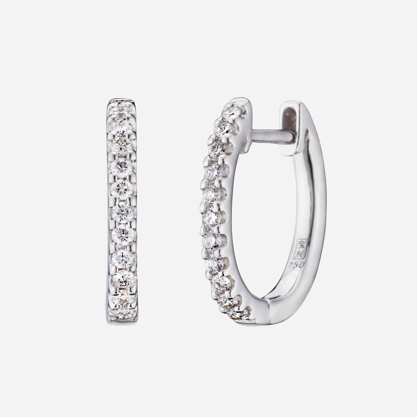 diamond huggie earrings in 18k white gold, featuring a row of petite sparkling diamonds along the rim.