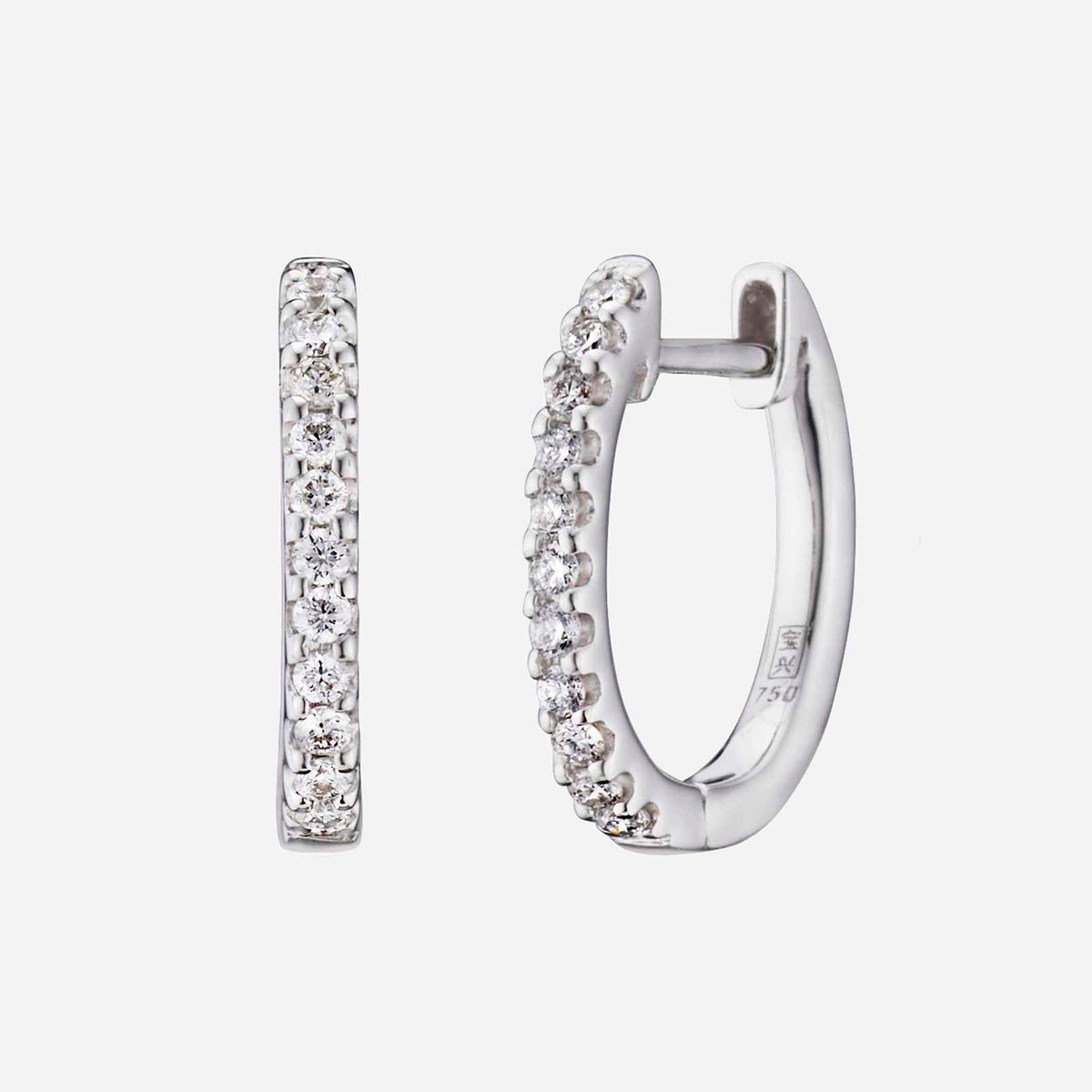 diamond huggie earrings in 18k white gold, featuring a slim design with a line of diamonds along the rim.