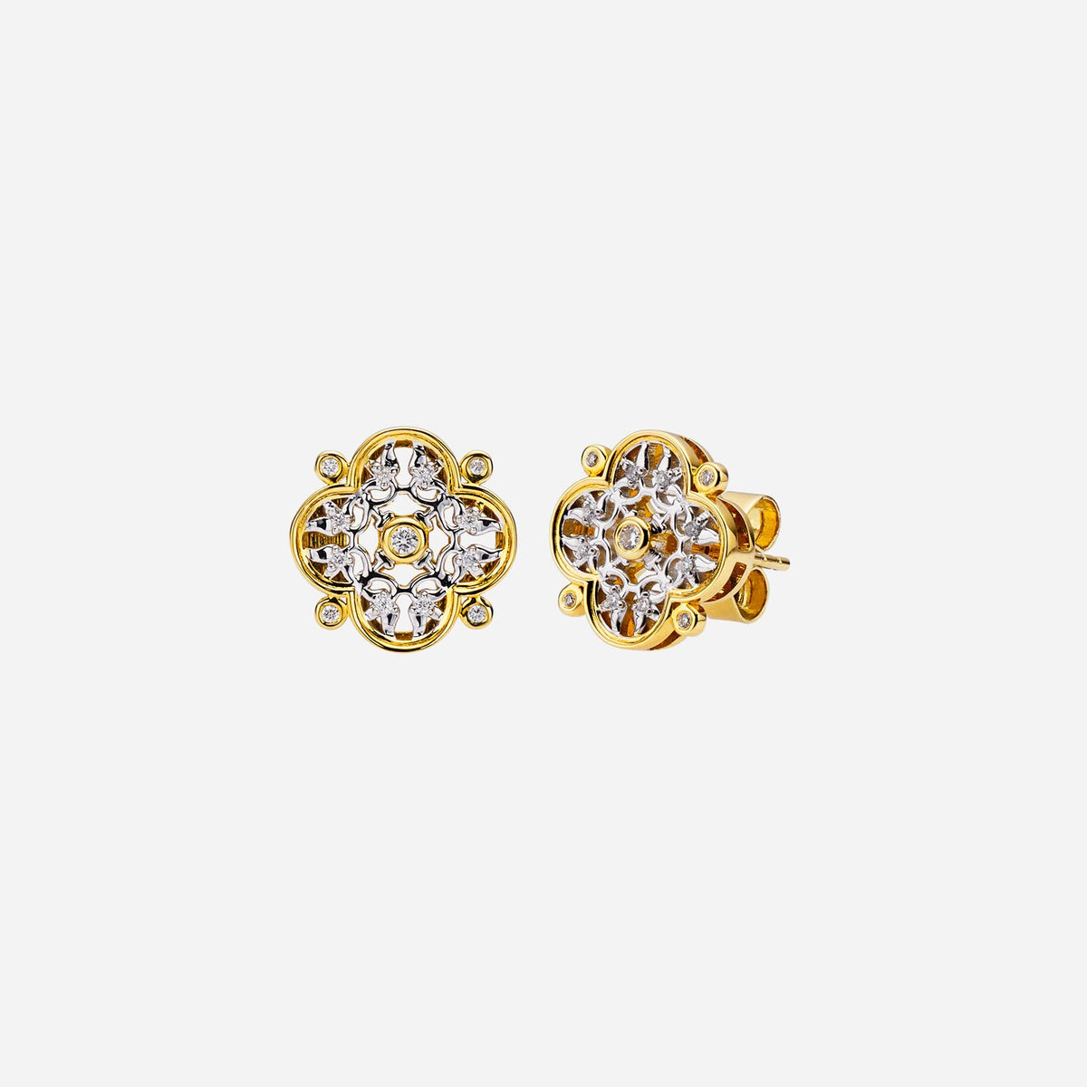 legacy floral diamond earrings in yellow and white gold featuring brilliant cut diamonds in a floral design.