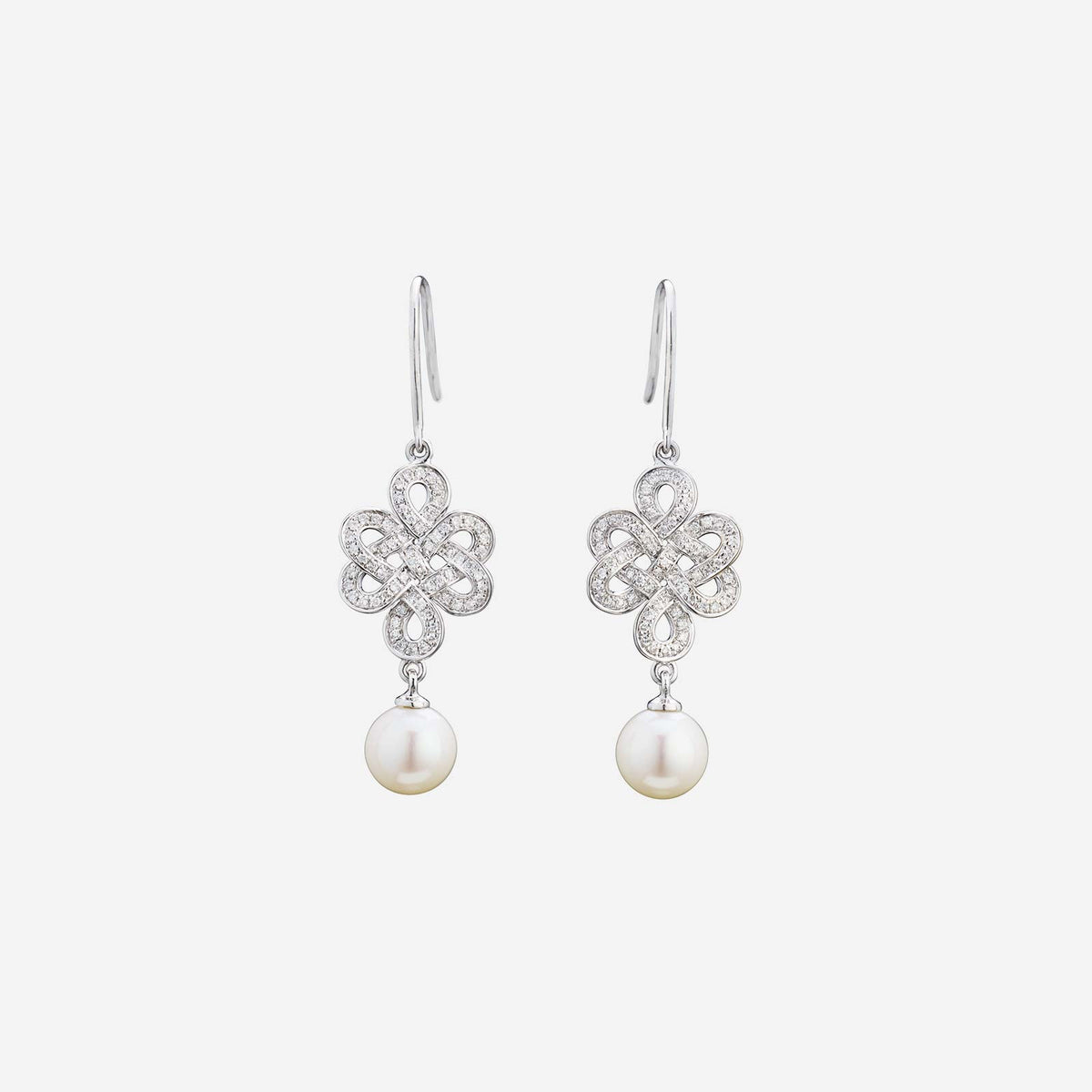 eternity knot earrings in 18k white gold with diamonds and iridescent freshwater pearls dangling design.