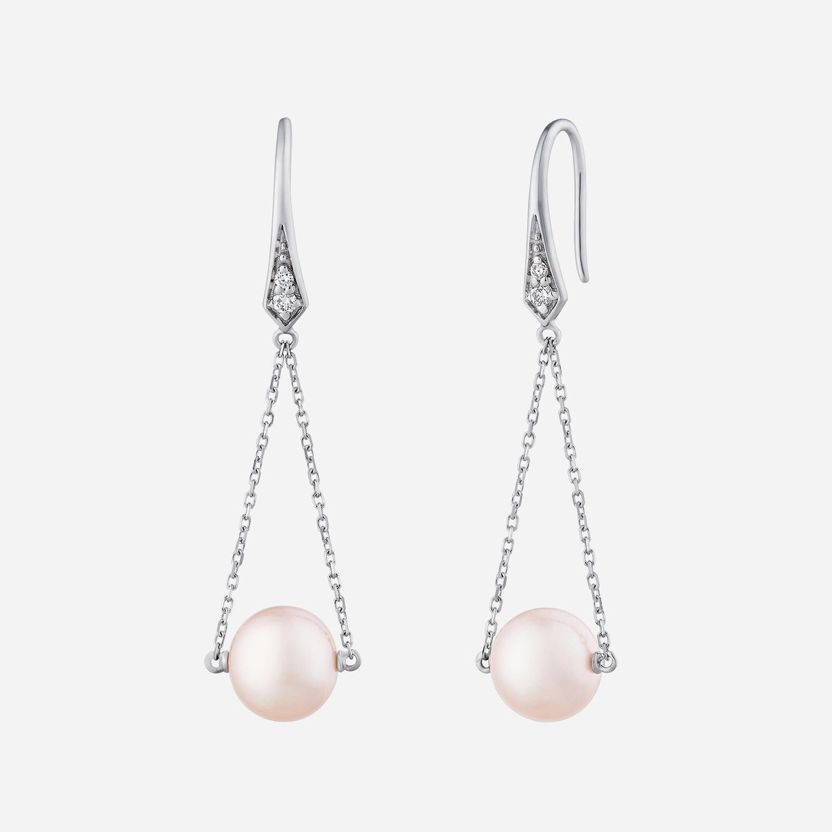 freshwater pearl earrings in 18k white gold with delicate diamond accents and a hanging chain design.