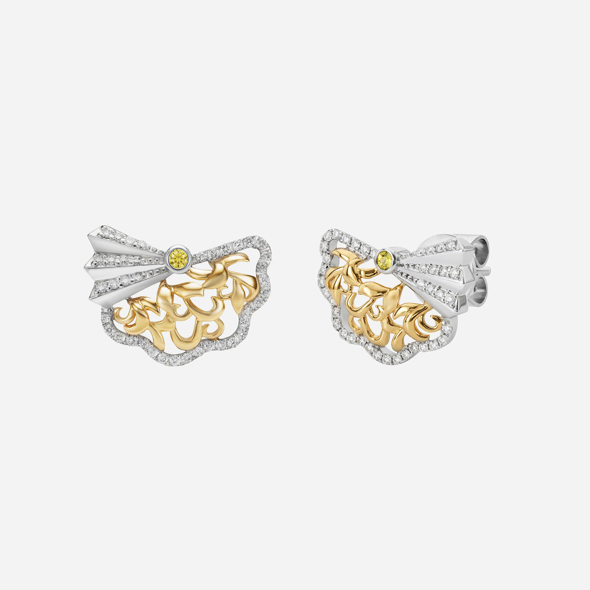 legacy earrings in yellow and white gold with diamond accents and yellow sapphire centerpiece, featuring intricate openwork design.