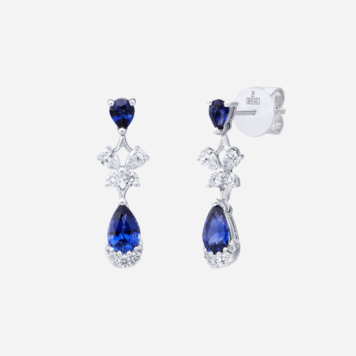 blue sapphire earrings with pear-shaped stones, diamond accents, and a vintage drop design in 18k white gold.