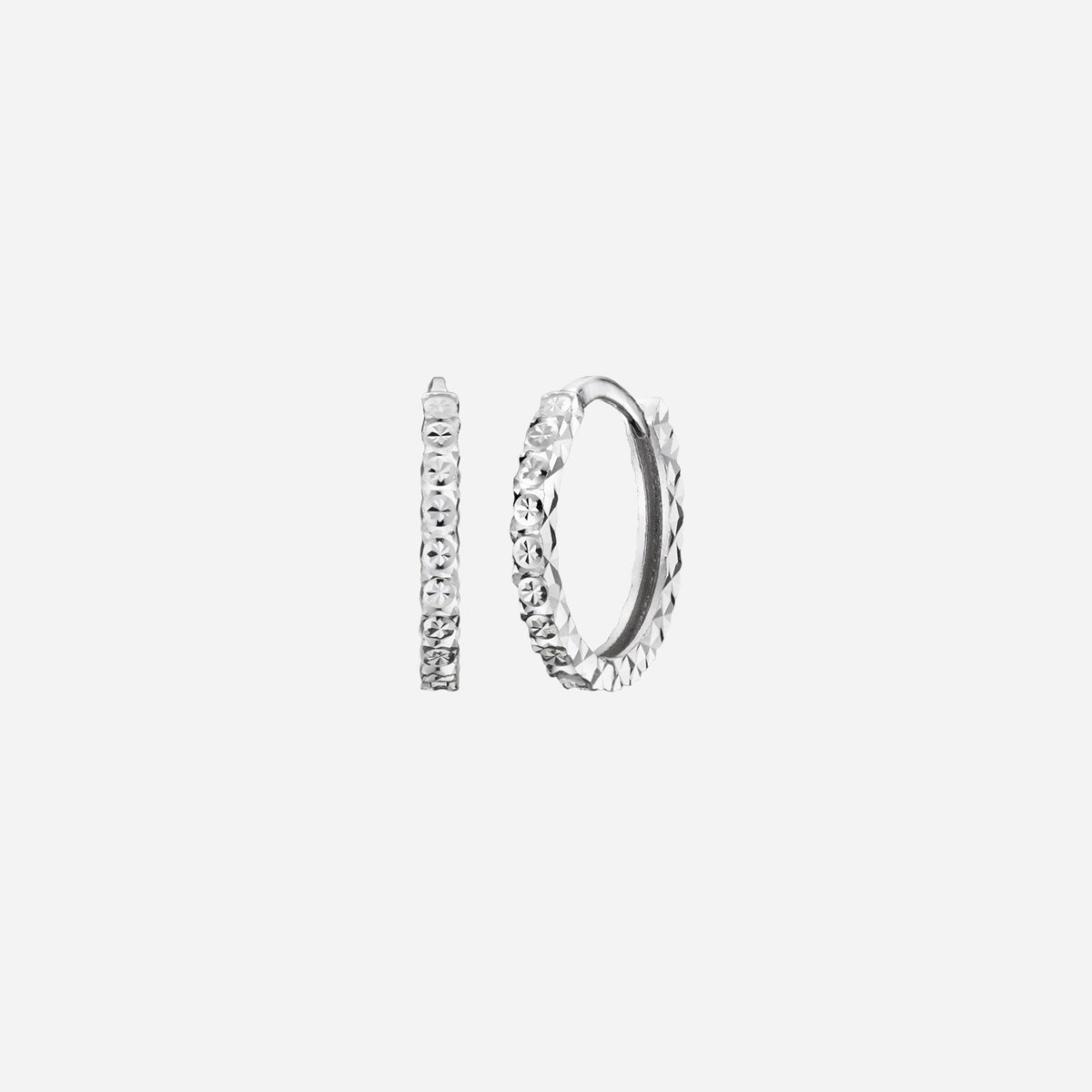 textured huggie earrings in 18k white gold with intricate cut detailing for a modern twist on a classic design.