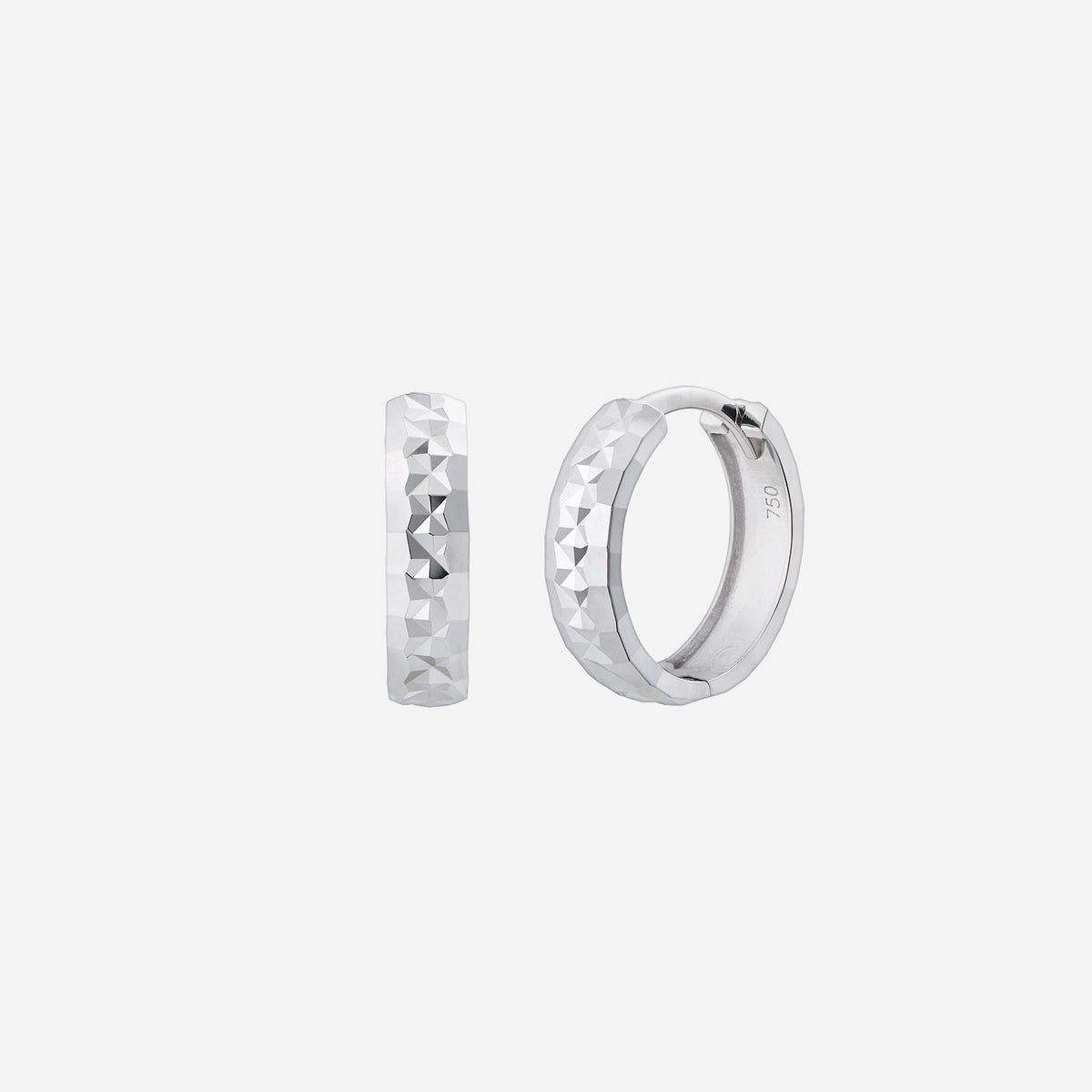 textured huggie earrings in 18k white gold with a modern faceted design reflecting light beautifully.