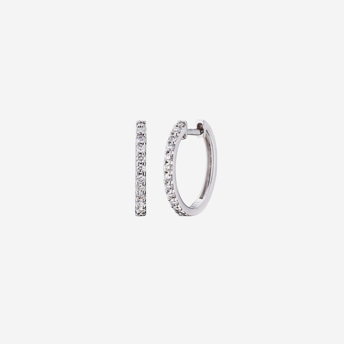 diamond huggie earrings in 18k white gold with a row of shimmering diamonds, totaling 0.28 carats.