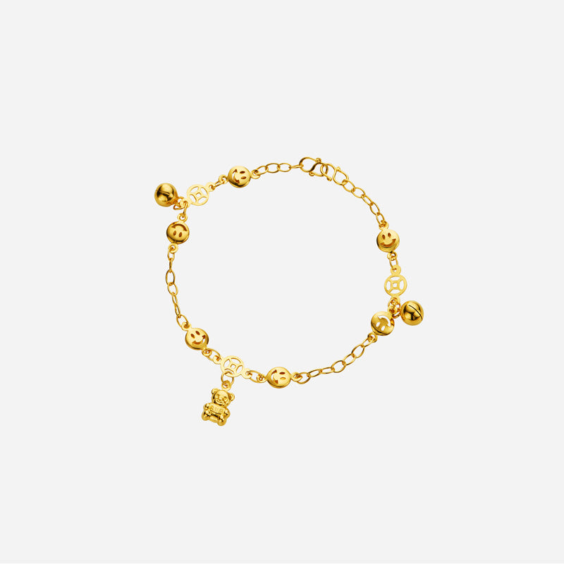 dainty yellow gold anklet with teddy bear charm, bells, smiley faces, and prosperity coins. perfect for baby.