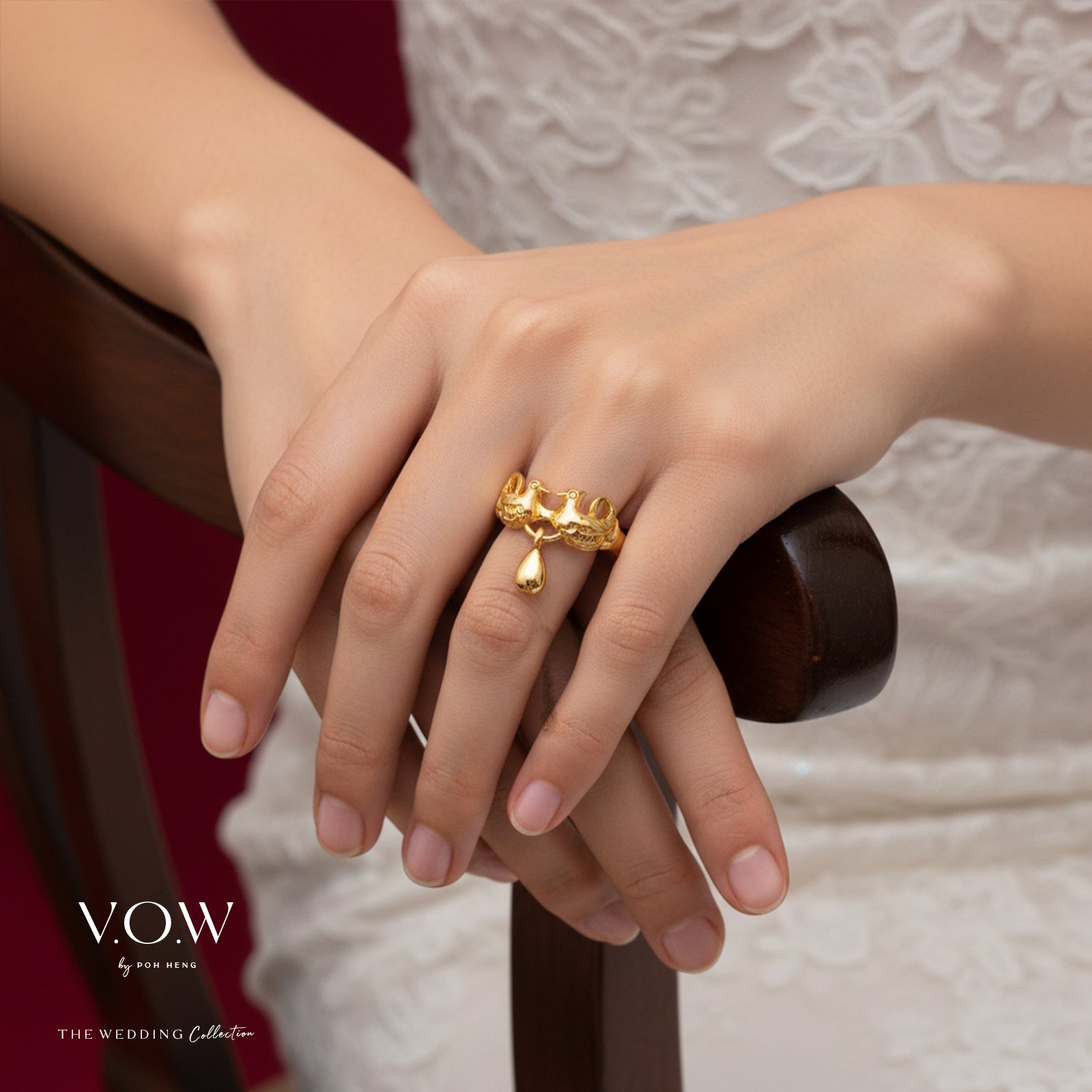 Mandarin Duck ring in 22K yellow gold with intricate design and a dangling teardrop charm. Symbol of everlasting love.