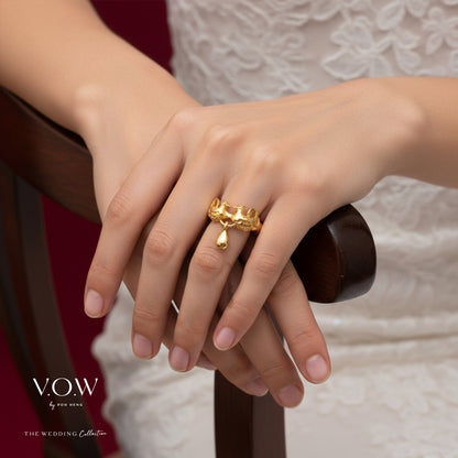 Mandarin Duck ring in 22K yellow gold with intricate design and a dangling teardrop charm. Symbol of everlasting love.