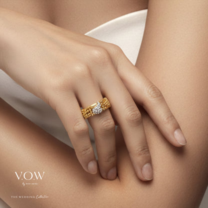 Gleam of Devotion Ring in 22K yellow and white gold with intricate beadwork and a sparkling centered gemstone.