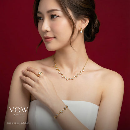 Flowing Romance ring in 22K yellow and white gold with a graceful wave design, symbolizing love's enduring bond.