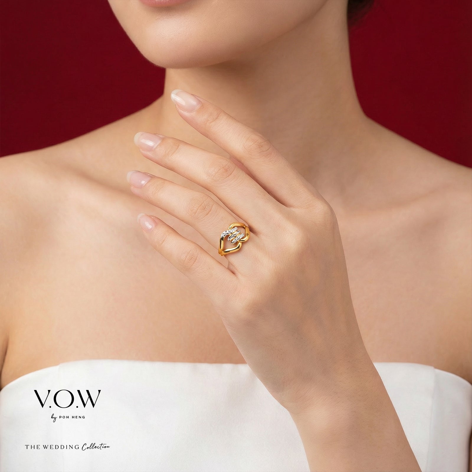 Elegance Torus Ring in yellow and white gold featuring a sculpted design with a prominent gemstone.