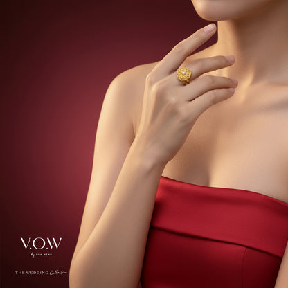 Radiant Blossom Ring in 24K yellow gold with pink enamel petals and a luminous pearl centerpiece.