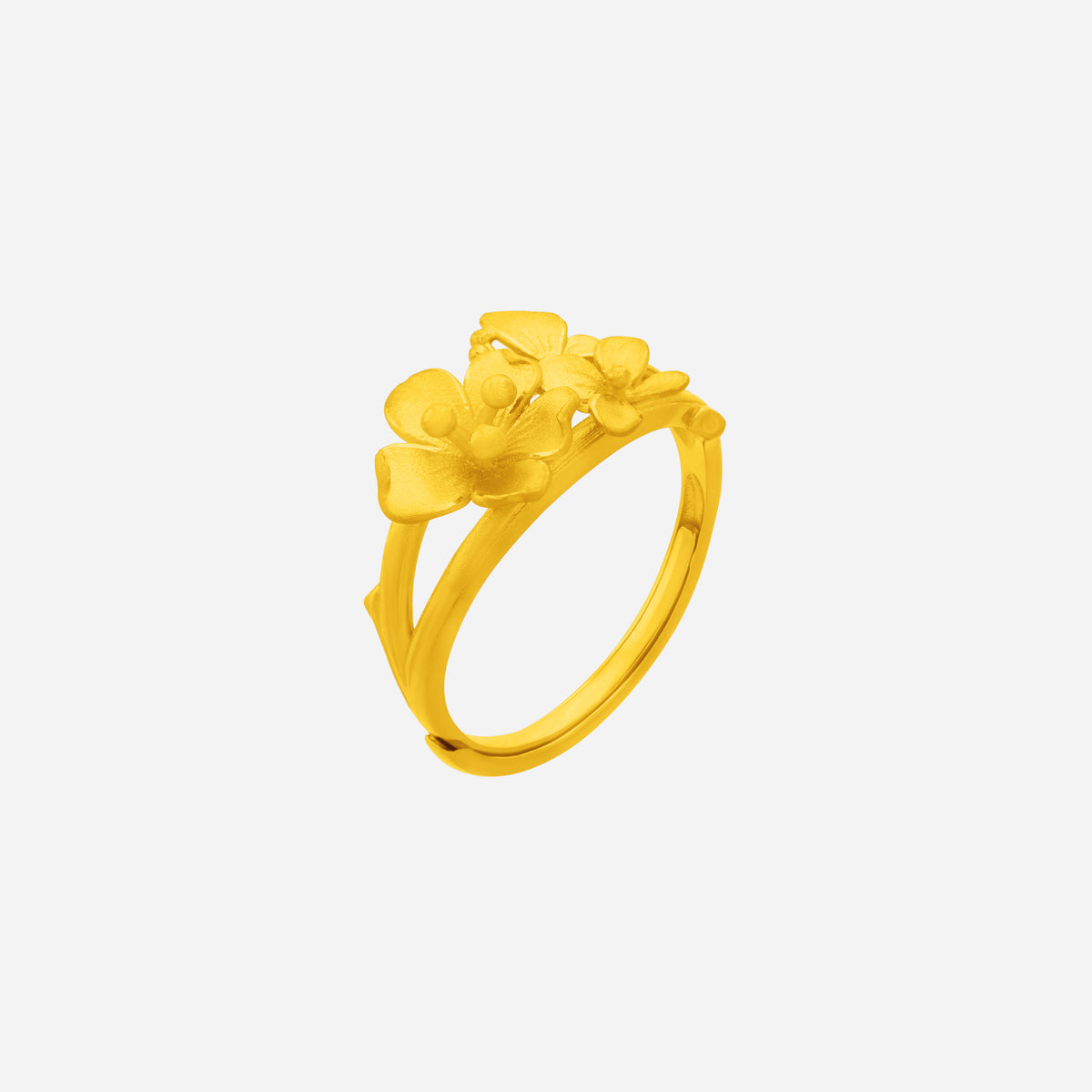 Vibrant Bloom Ring in 24K yellow gold featuring floral designs with varied petal shapes and textured details.