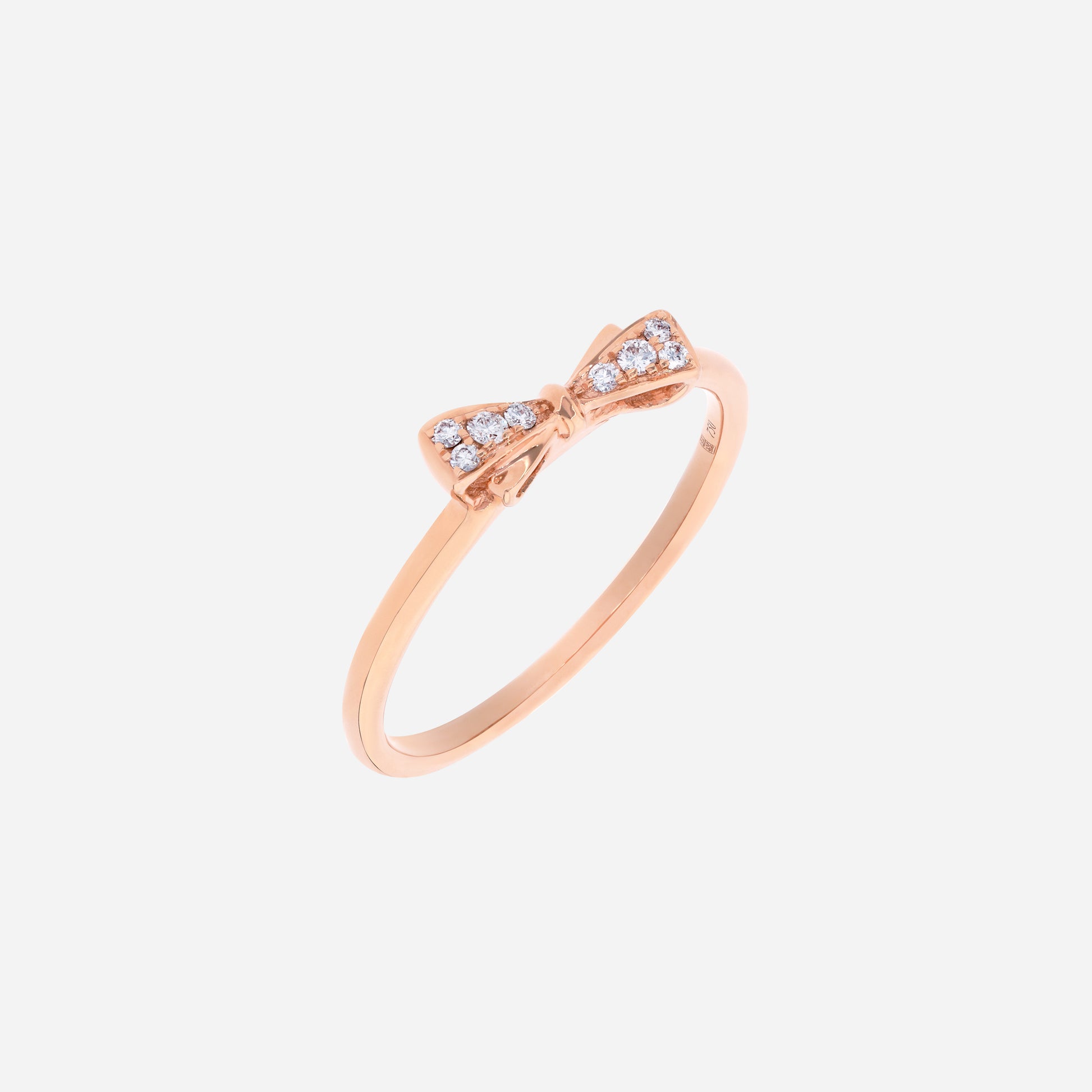 Dulcea Bow Diamond Ring in 18K rose gold with petite diamond bow on a slender band, offering youthful elegance and sparkle.