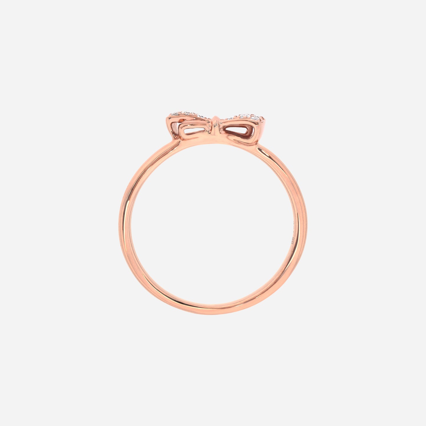 dulcea bow diamond ring in 18k rose gold with a petite diamond-set bow on a slender band.