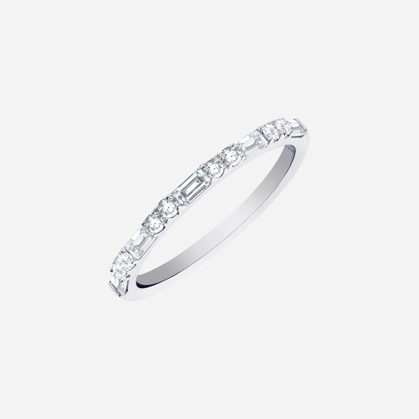 slim polished white gold diamond ring with alternating round and baguette-cut diamonds, modern sparkle design.