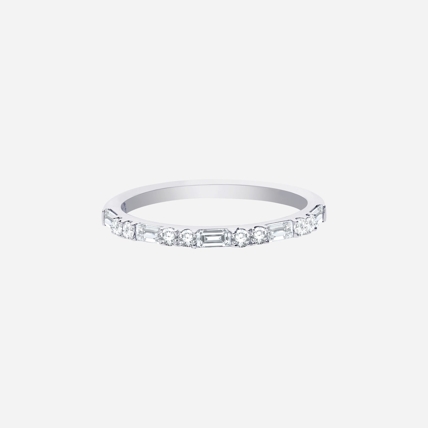 slim polished white gold ring set with alternating diamond cuts for a modern sparkle. ideal for stacking or solo wear.