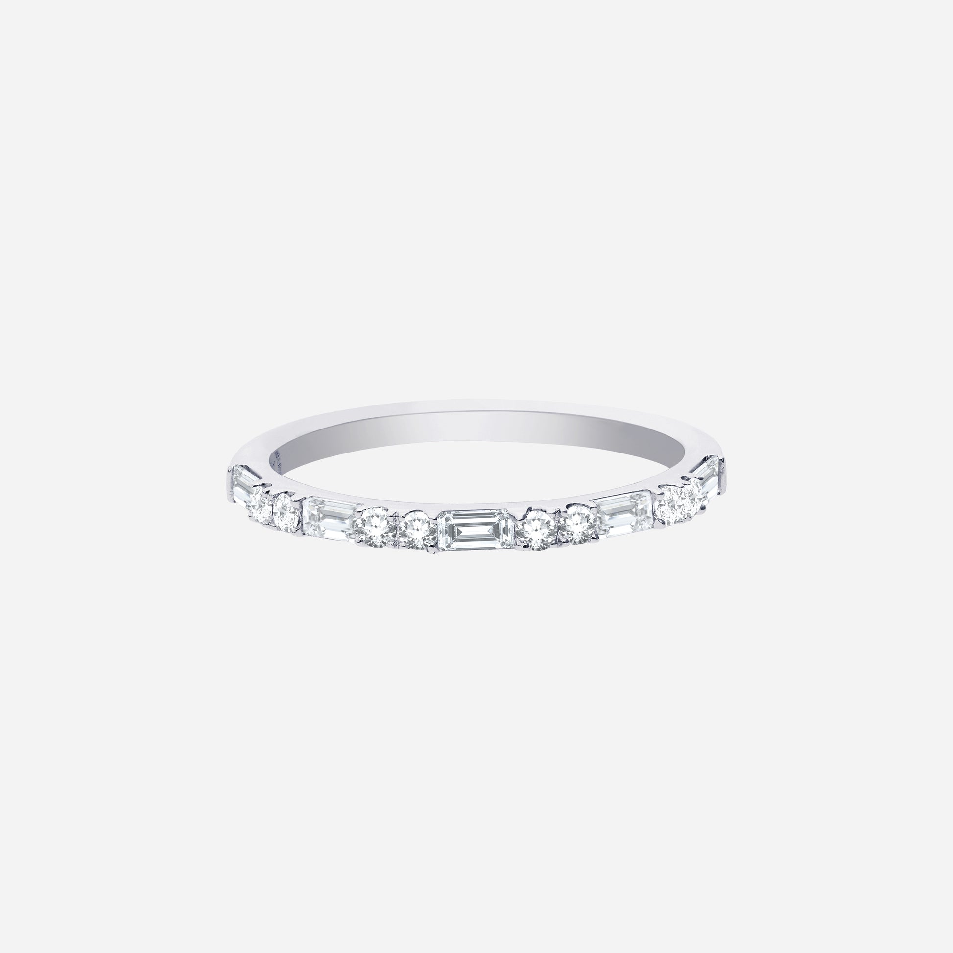 Slim polished white gold ring set with alternating diamond cuts for a modern sparkle. Ideal for stacking or solo wear.