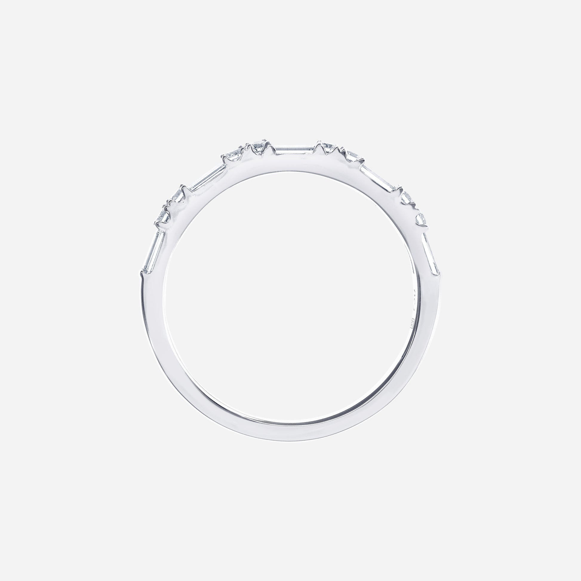 Slim polished diamond ring in 18K white gold with alternating diamond cuts for a modern sparkle.