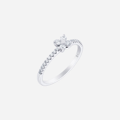 Glimmer Blossom diamond ring in 18K white gold with floral cluster and pavé-lined band design. Feminine and refined.