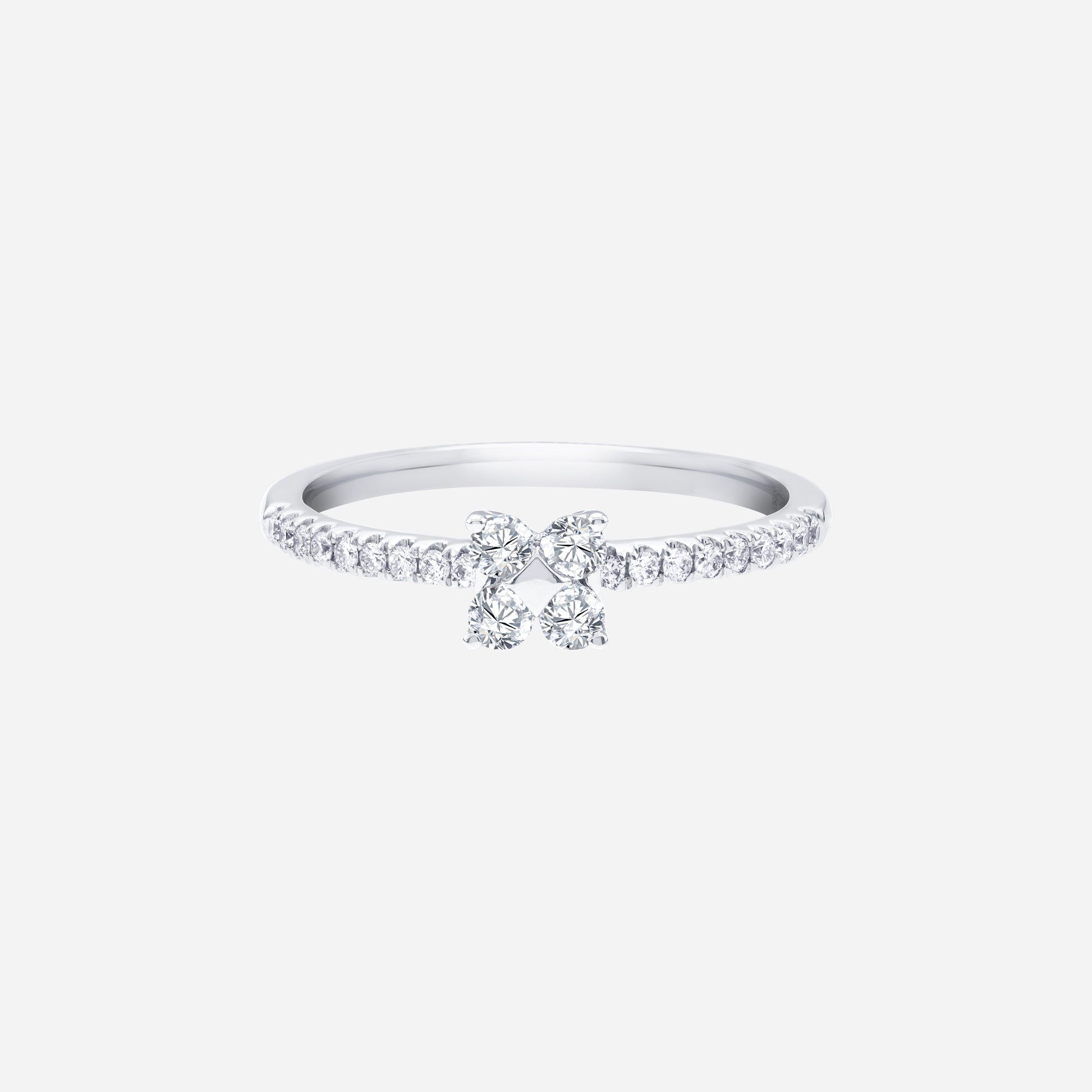 Glimmer Blossom diamond ring in 18K white gold with floral diamond cluster and pavé-lined band. Elegant and feminine design.