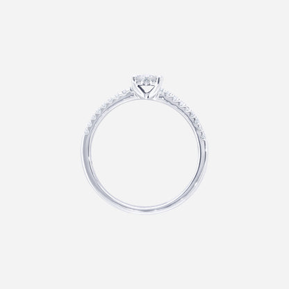 Glimmer Blossom diamond ring in 18K white gold with floral cluster center and pavé-lined band. Feminine and elegant design.