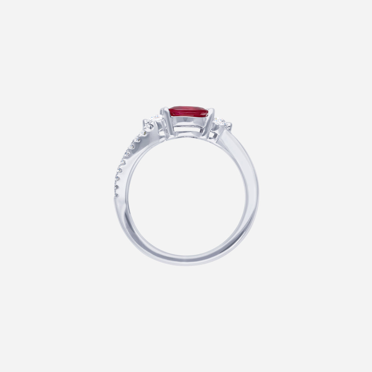 Ruby oval-cut ring in 18K white gold, featuring twin diamonds and a twisted pavé band design.