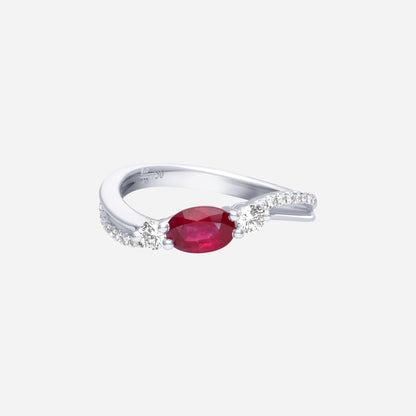 Ruby oval-cut ring in 18K white gold, featuring twin diamonds and a twisted pavé band.