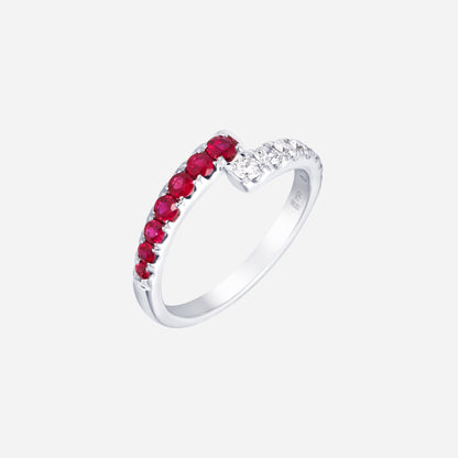 Ruby and diamond ring in 18K white gold with a curved design featuring vibrant red rubies and sparkling diamonds.