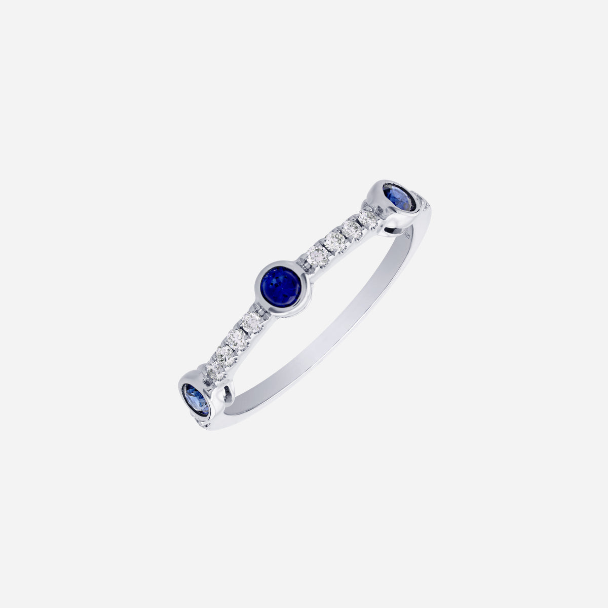 blue sapphire and diamond ring in 18k white gold with round sapphires and fine diamond detailing.