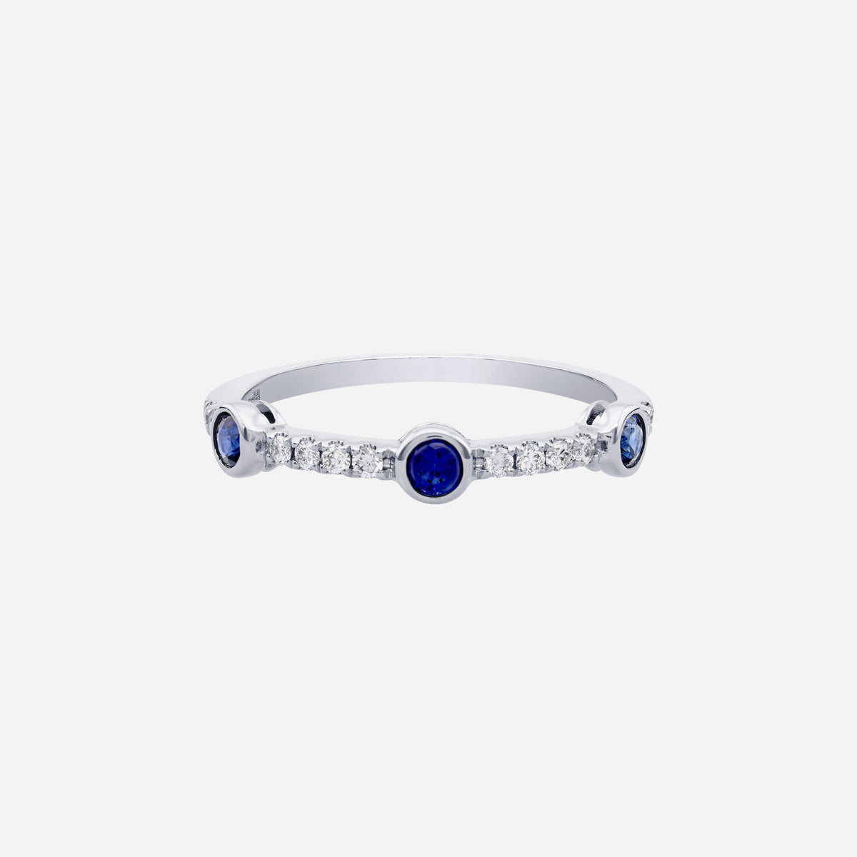 Blue sapphire and diamond ring in 18K white gold with round sapphires and fine diamond detailing.