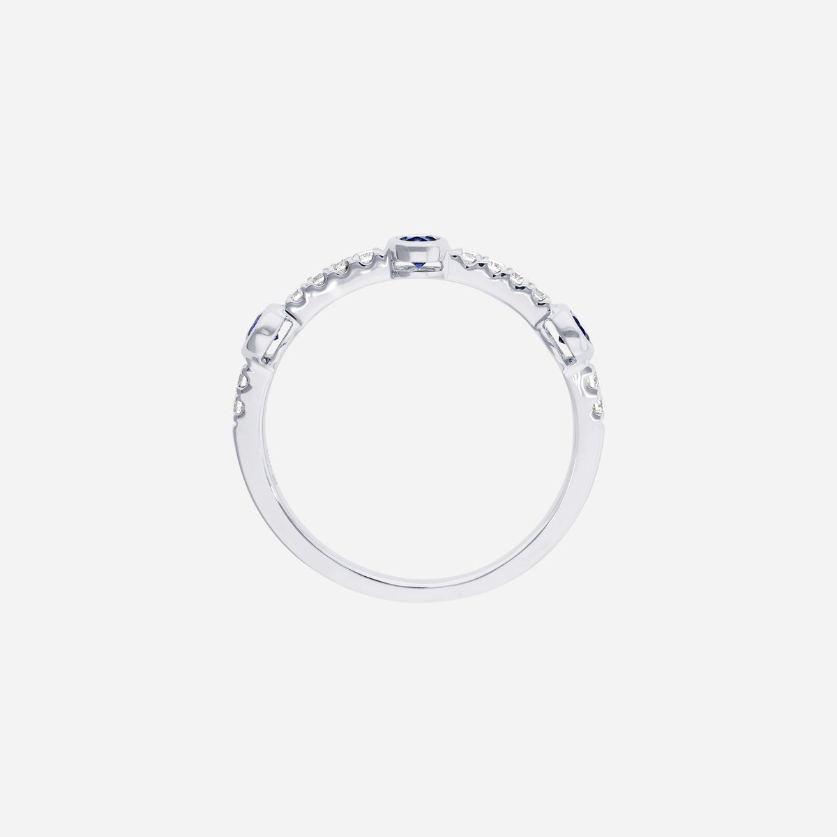 blue sapphire and diamond ring in 18k white gold with round sapphires and diamond accents on a slender band.