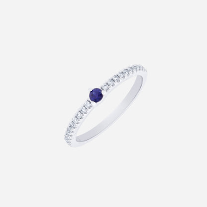 Blue sapphire and diamond ring in 18K white gold with a round blue sapphire center and sparkling diamond accents.