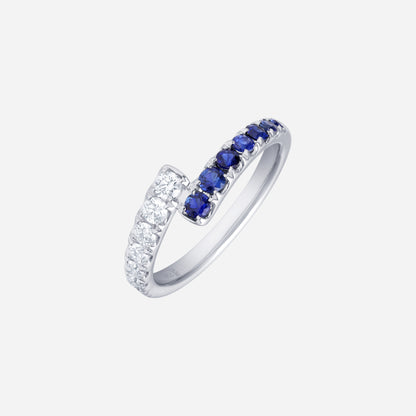 Blue sapphire and diamond ring in 18K white gold, featuring a curve of deep-blue sapphires and sparkling diamonds.