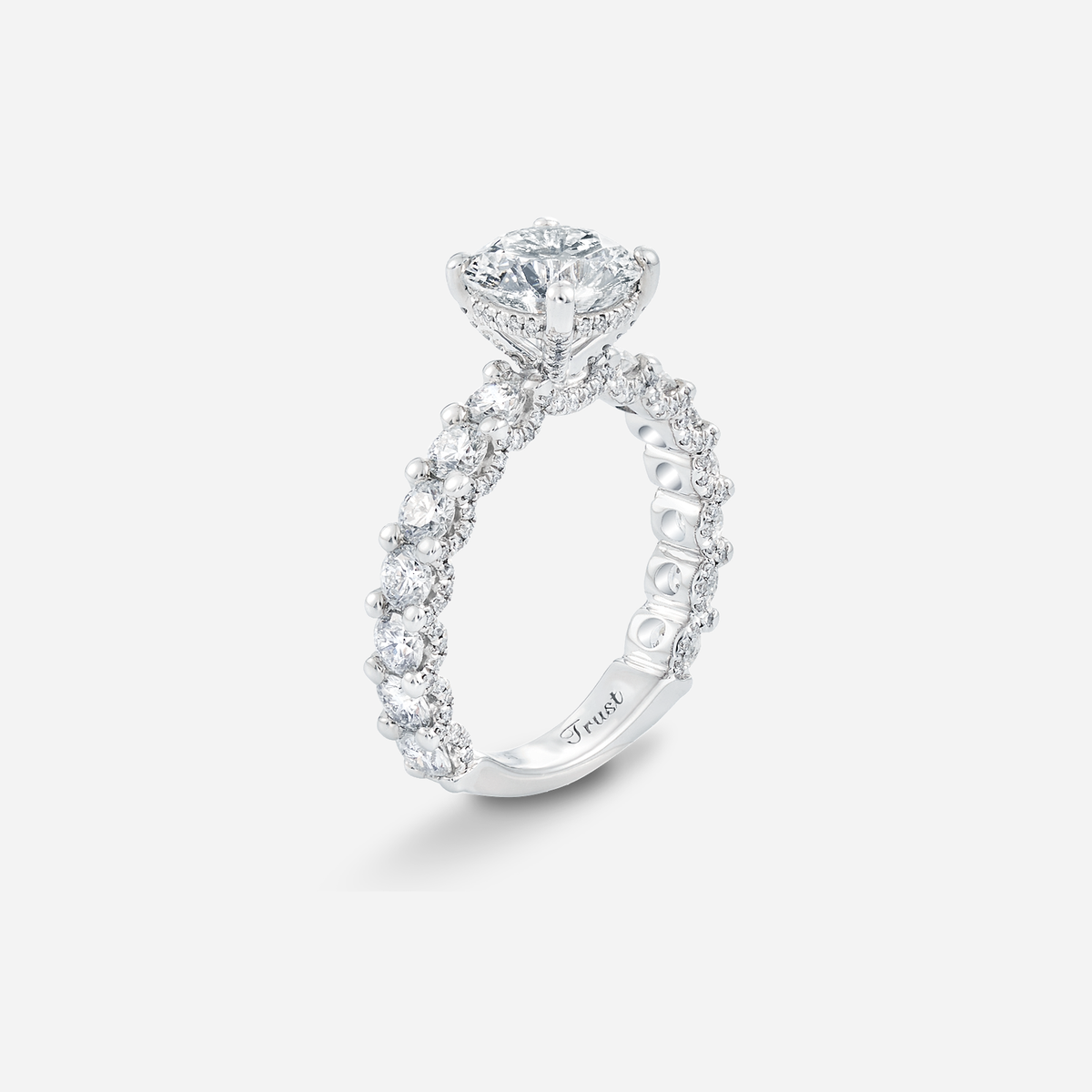 invisible diamond ring in white gold with round-cut center stone and shimmering pave band design.