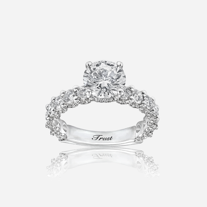 Trust invisible diamond ring in white gold with a round center stone and sparkling halo design.