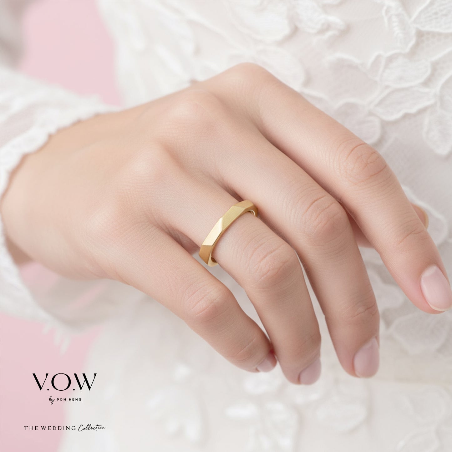22k yellow gold endless love band featuring a sleek, geometric design, worn on a delicate hand.