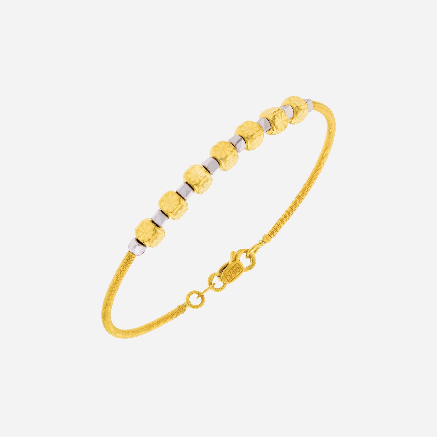 celestial whispers bangle in 22k yellow and white gold with faceted cube beads, elegant design for everyday wear.