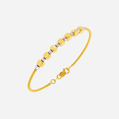 Celestial Whispers Bangle in 22K yellow and white gold with faceted cube beads, elegant design for everyday wear.