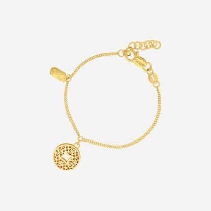 Joyful Baby Bracelet in 22K yellow gold with fine chain and small auspicious charms for little wrists.