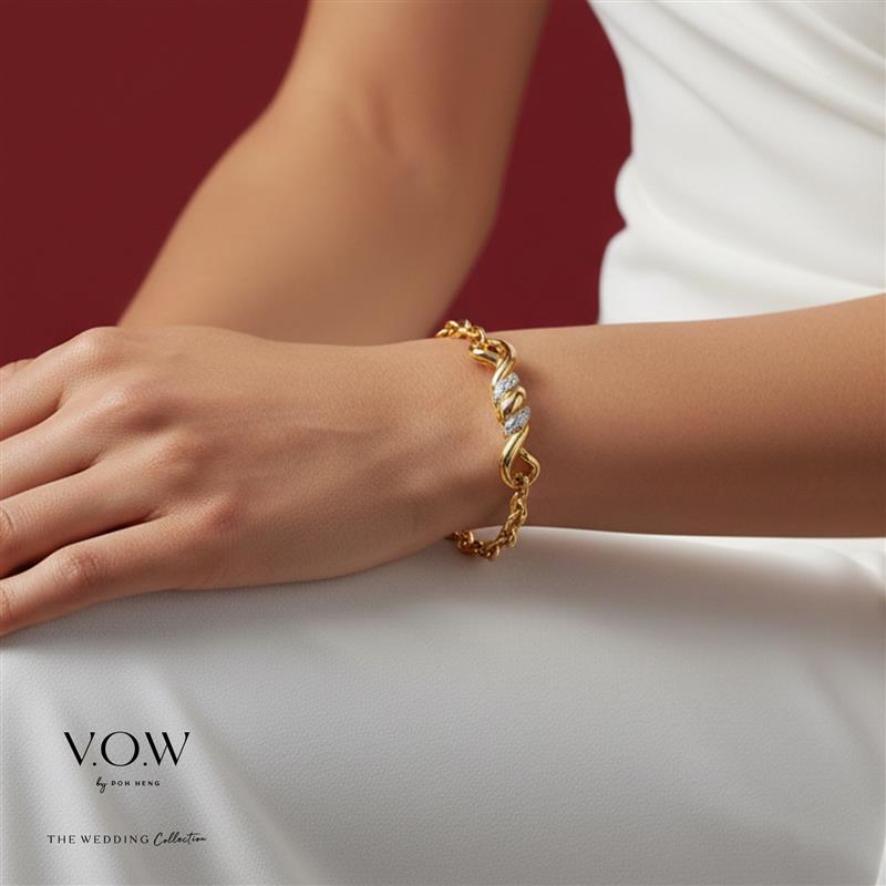 Yellow and white gold Infinite Love bracelet featuring an infinity motif on a hand against a red background.