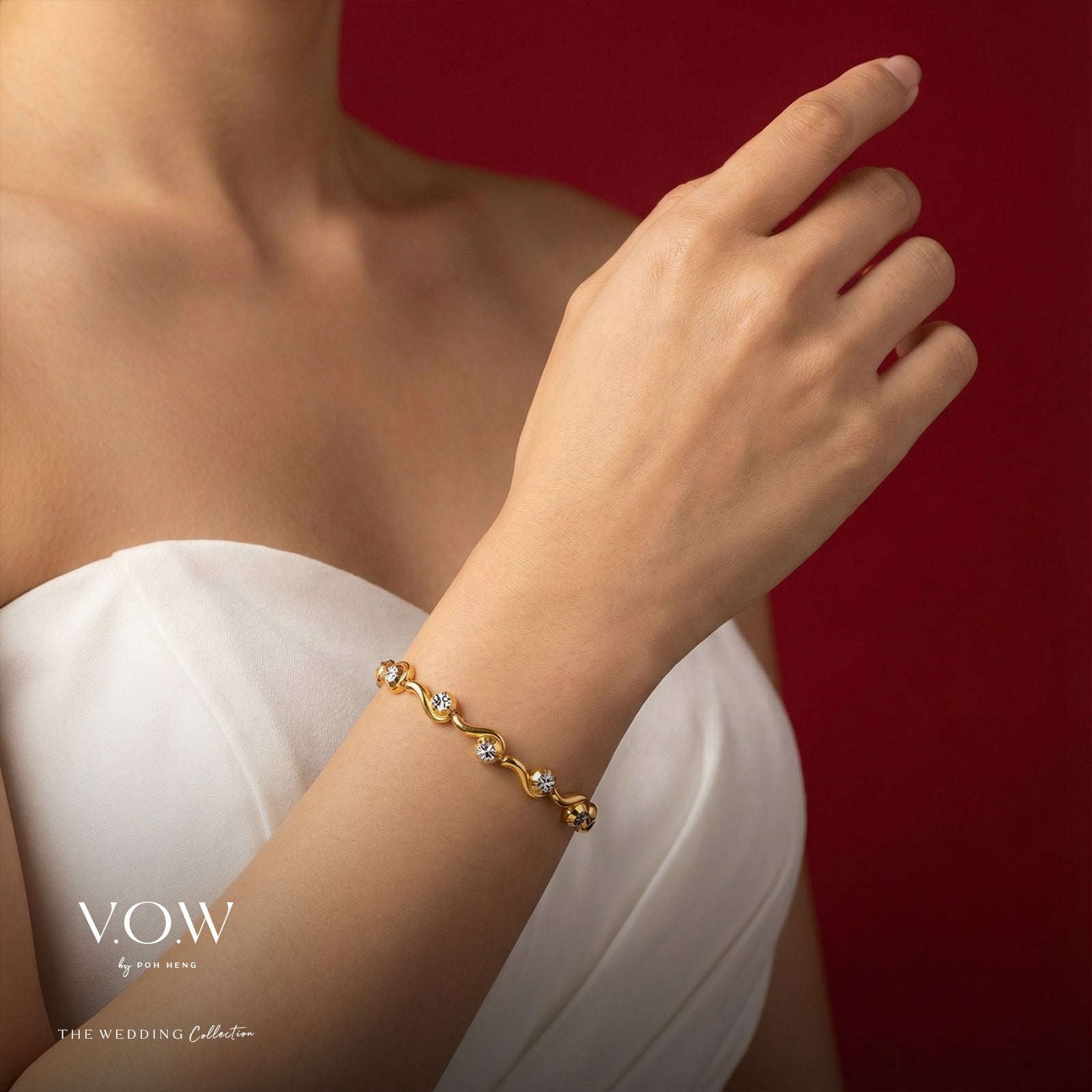 Flowing Romance bracelet in 22K yellow and white gold with a wave motif and sparkling gemstones, elegantly worn on a wrist.