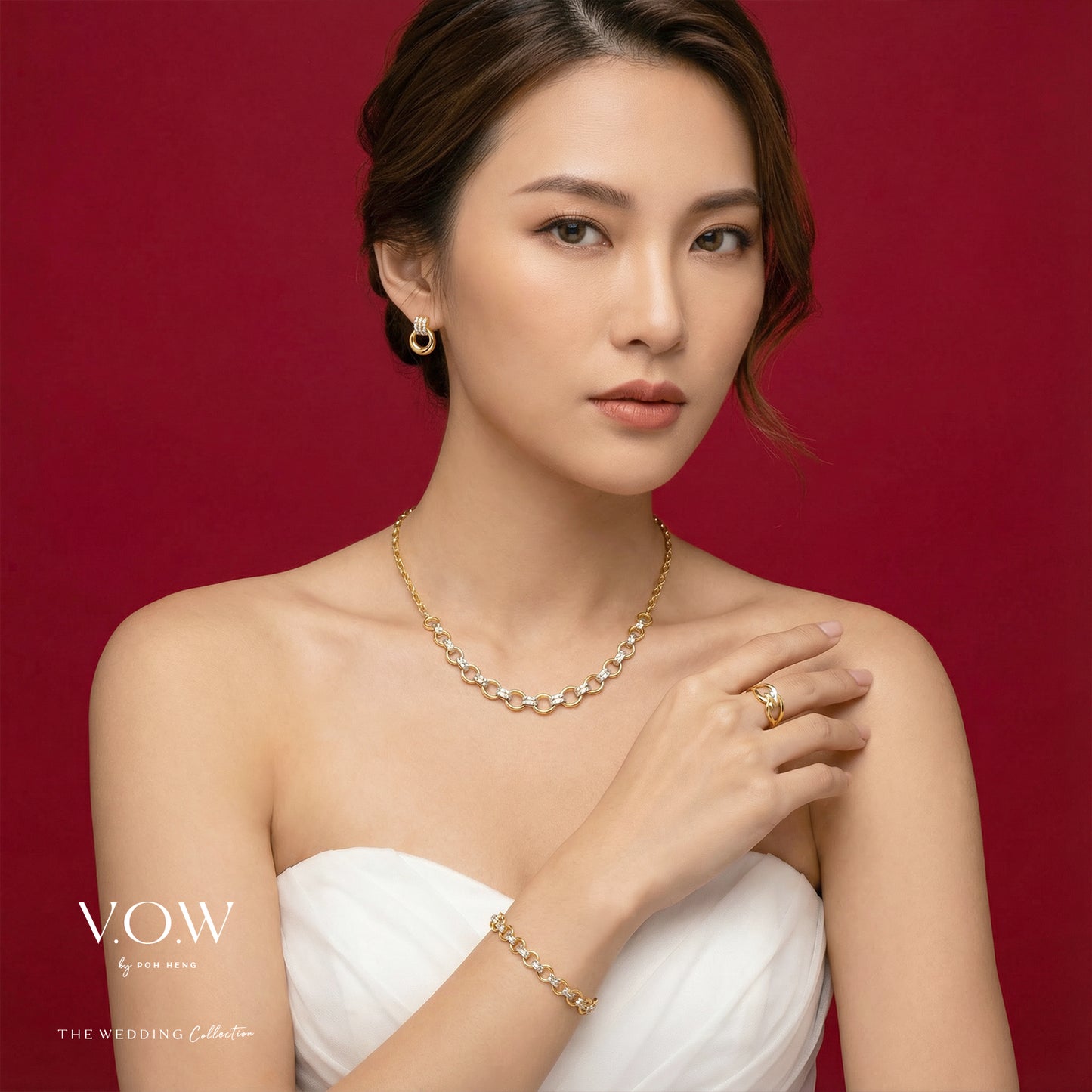 elegance torus bracelet in 22k yellow and white gold with a sculpted design, showcased on a model's wrist.